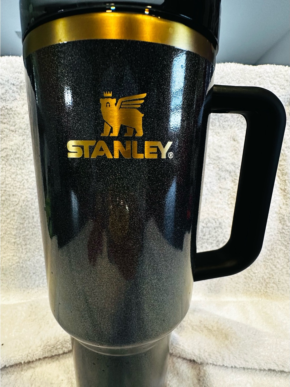 Stanley Black Travel Mug with Gold Accents and Handle